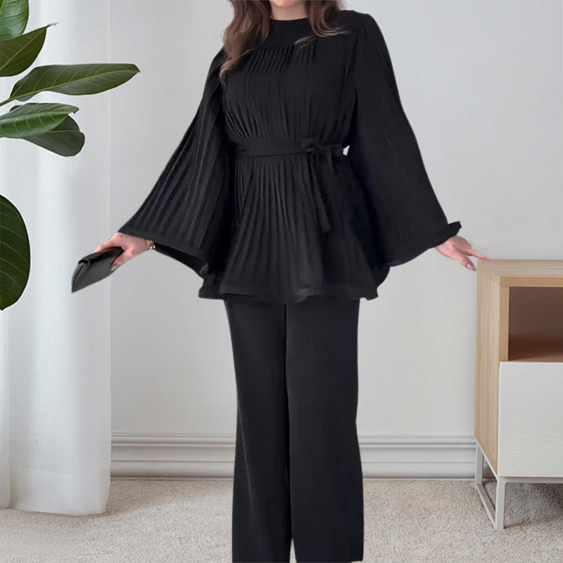 Two-piece suit made of pleated fabric